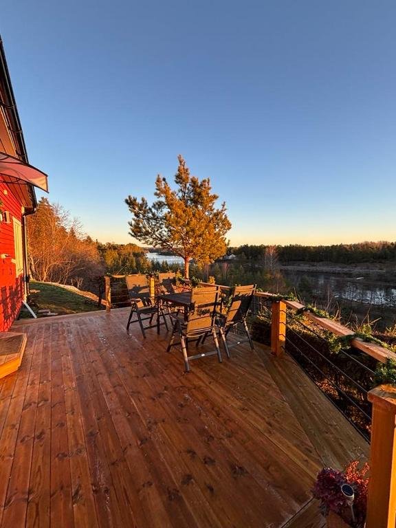 Wooden terrace of Lillstugan at sunset